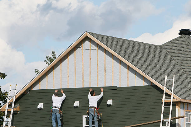 Professional Storm Damage Siding Repair technician working in McGrady, NC